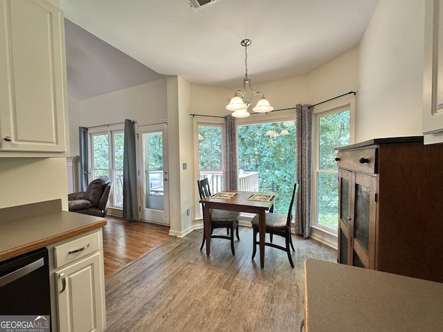235 Pirkle Ct, Cumming, GA 30040 - dining area with wood finished floors and a chandelier