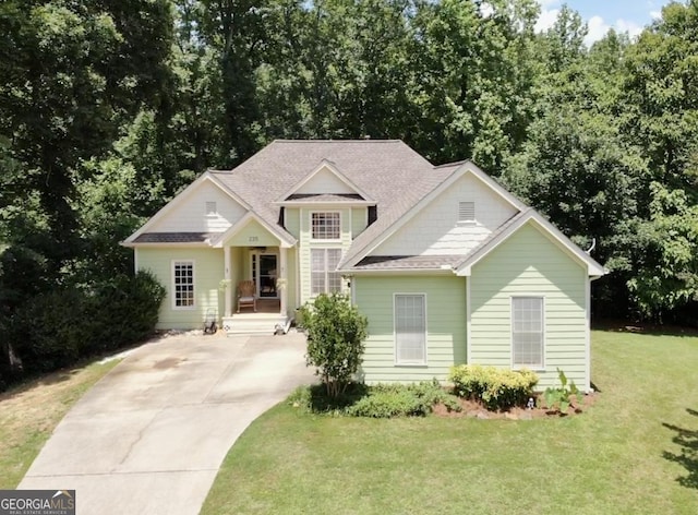 235 Pirkle Ct, Cumming, GA 30040 - traditional-style house featuring a front yard, concrete driveway, and a shingled roof
