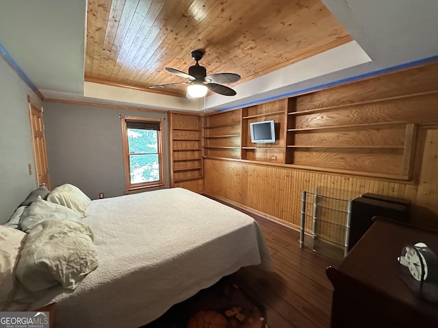 235 Pirkle Ct, Cumming, GA 30040 - bedroom with a tray ceiling, wood ceiling, dark wood-style floors, wooden walls, and crown molding