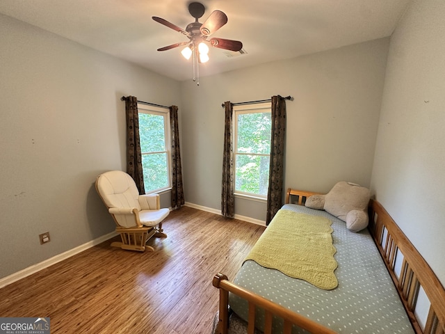 235 Pirkle Ct, Cumming, GA 30040 - bedroom with wood finished floors and ceiling fan