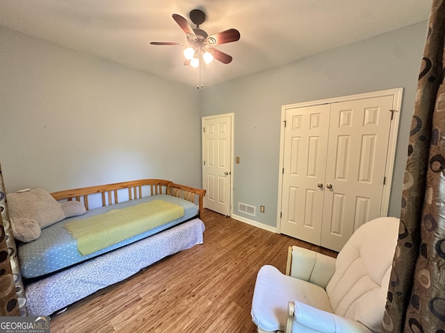 235 Pirkle Ct, Cumming, GA 30040 - bedroom with wood finished floors, a closet, and a ceiling fan