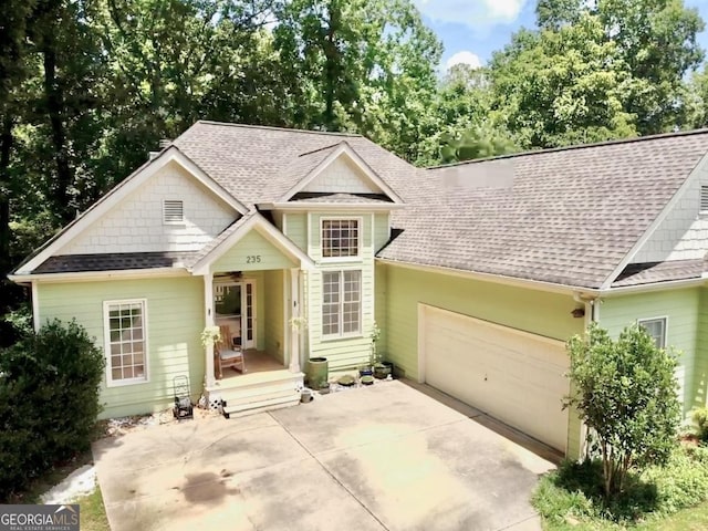 235 Pirkle Ct, Cumming, GA 30040 - traditional-style house with a shingled roof, an attached garage, and driveway
