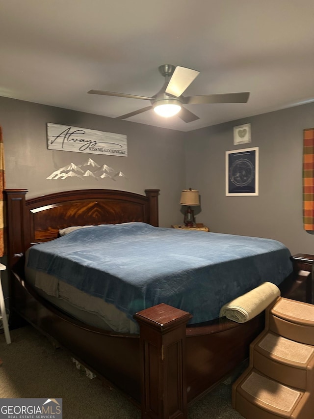 1408 Main St, Perry, GA 31069 - carpeted bedroom with a ceiling fan