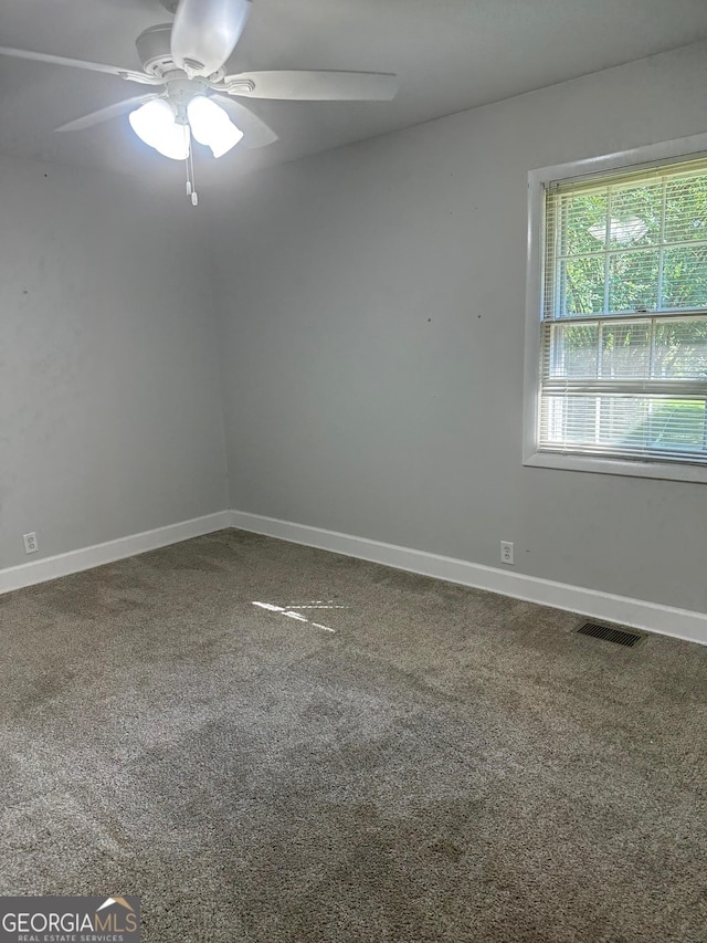 1408 Main St, Perry, GA 31069 - carpeted spare room featuring a ceiling fan and baseboards