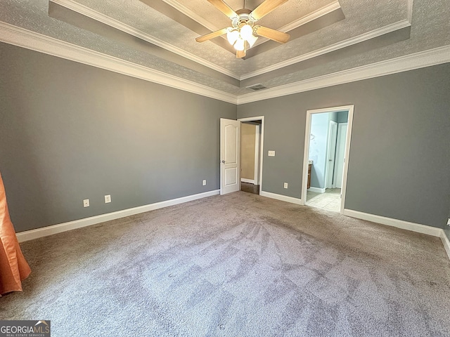 101 Riverchest Dr, Lagrange, GA 30240 - unfurnished bedroom featuring a tray ceiling, crown molding, carpet flooring, ensuite bathroom, and a textured ceiling
