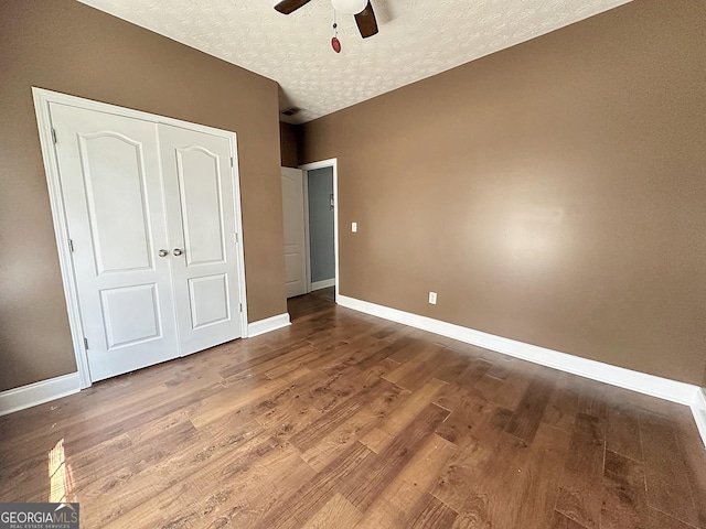 101 Riverchest Dr, Lagrange, GA 30240 - unfurnished bedroom featuring a textured ceiling, wood finished floors, a closet, and a ceiling fan