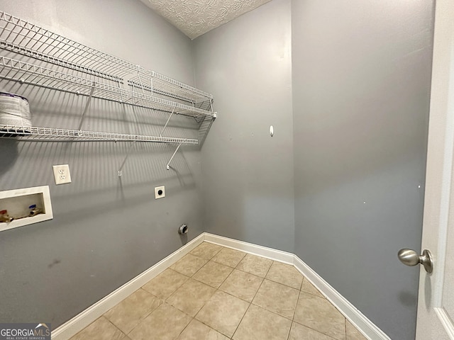 101 Riverchest Dr, Lagrange, GA 30240 - laundry room featuring hookup for an electric dryer, washer hookup, and tile patterned flooring