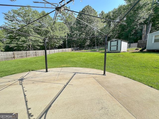 101 Riverchest Dr, Lagrange, GA 30240 - fenced backyard with a shed, a patio area, and view of wooded area