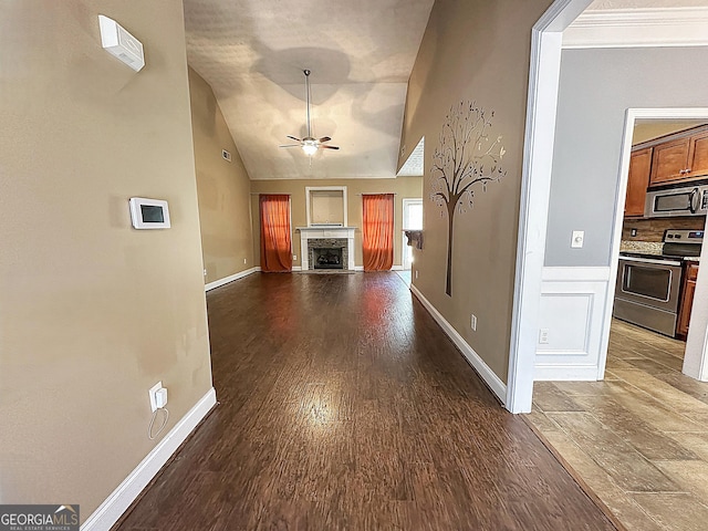 101 Riverchest Dr, Lagrange, GA 30240 - unfurnished living room with lofted ceiling, ceiling fan, dark wood finished floors, and a fireplace