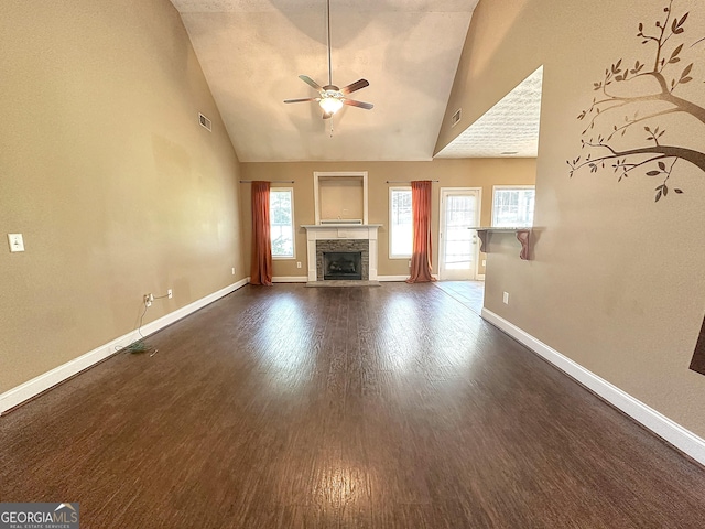 101 Riverchest Dr, Lagrange, GA 30240 - unfurnished living room featuring a ceiling fan, a fireplace, high vaulted ceiling, and dark wood finished floors