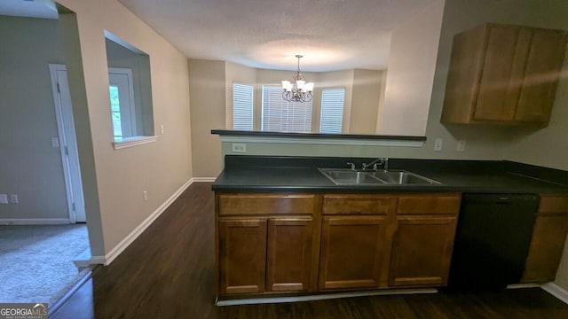 705 Mustang Ct, Hampton, GA 30228 - kitchen with dark countertops, a chandelier, black dishwasher, and plenty of natural light