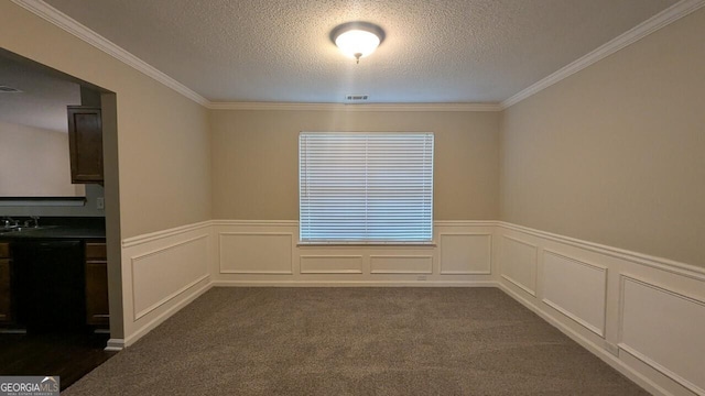 705 Mustang Ct, Hampton, GA 30228 - empty room featuring a textured ceiling, crown molding, wainscoting, and dark carpet