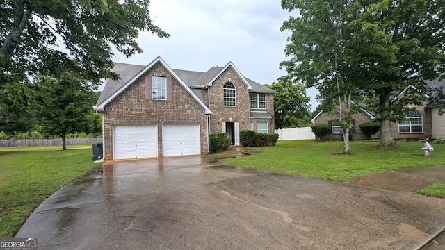 705 Mustang Ct, Hampton, GA 30228 - traditional-style house featuring brick siding, driveway, and a garage
