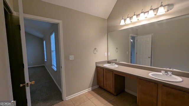 705 Mustang Ct, Hampton, GA 30228 - bathroom featuring vaulted ceiling, double vanity, and tile patterned floors