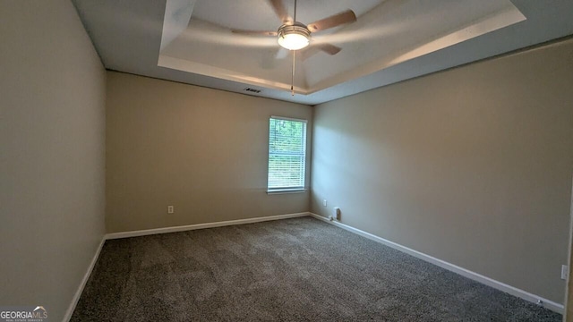 705 Mustang Ct, Hampton, GA 30228 - carpeted empty room with a ceiling fan and a raised ceiling