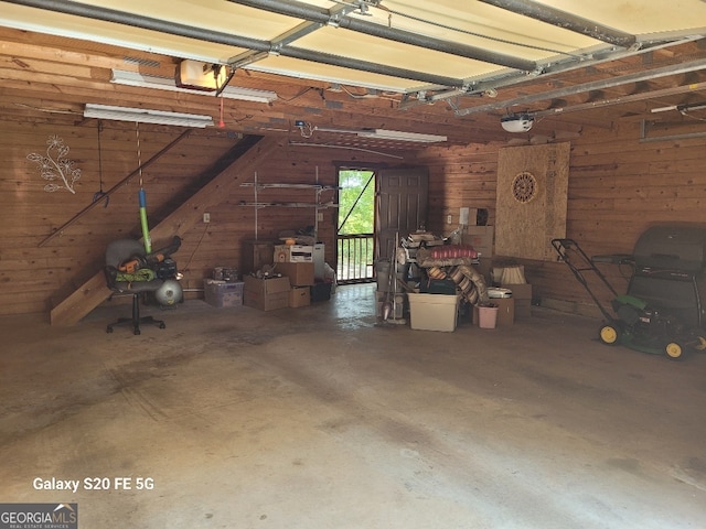 1904 S State Line Rd, Lagrange, GA 30240 - garage featuring wooden walls and a garage door opener