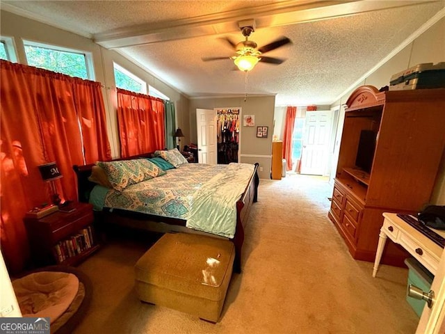 1570 Dean Mountain Rd, Cleveland, GA 30528 - bedroom with light colored carpet, ornamental molding, a textured ceiling, a walk in closet, and ceiling fan