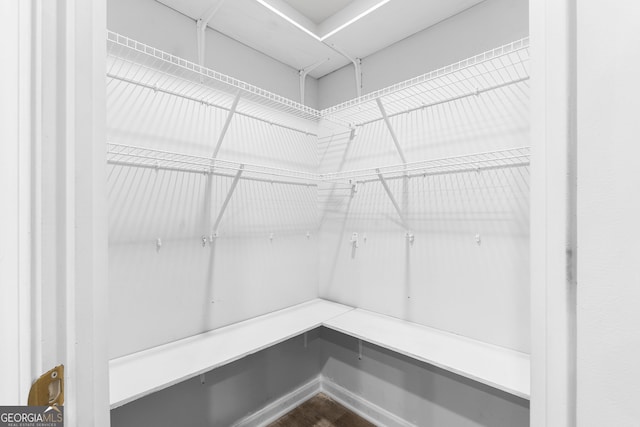 155 Shetland Pines Dr, Macon, GA 31216 - spacious closet featuring dark wood-style flooring