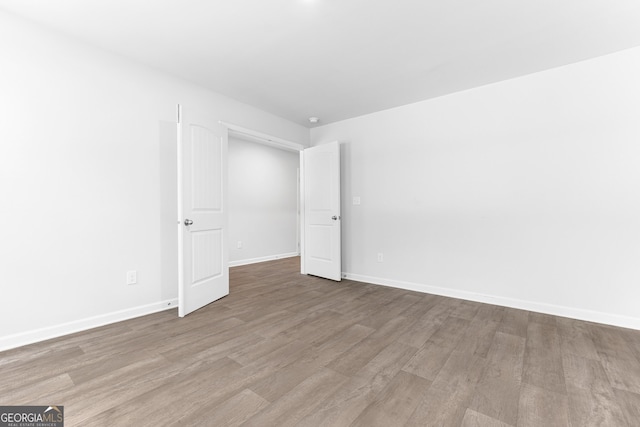 155 Shetland Pines Dr, Macon, GA 31216 - empty room featuring wood finished floors and baseboards