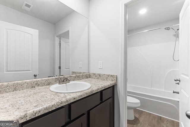 155 Shetland Pines Dr, Macon, GA 31216 - full bath with vanity,  shower combination, and wood finished floors