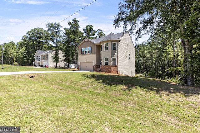 155 Shetland Pines Dr, Macon, GA 31216 - view of front of home featuring a garage, driveway, and a front lawn