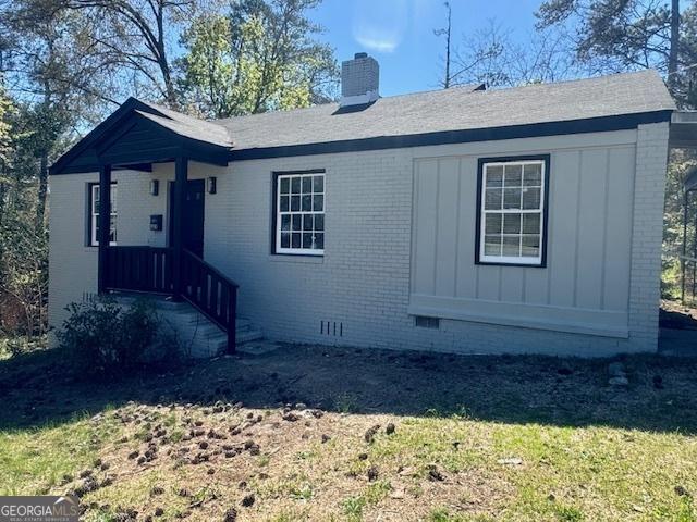 1930 Northbrook Ave, Macon, GA 31201 - single story home featuring a chimney, brick siding, crawl space, a front yard, and board and batten siding