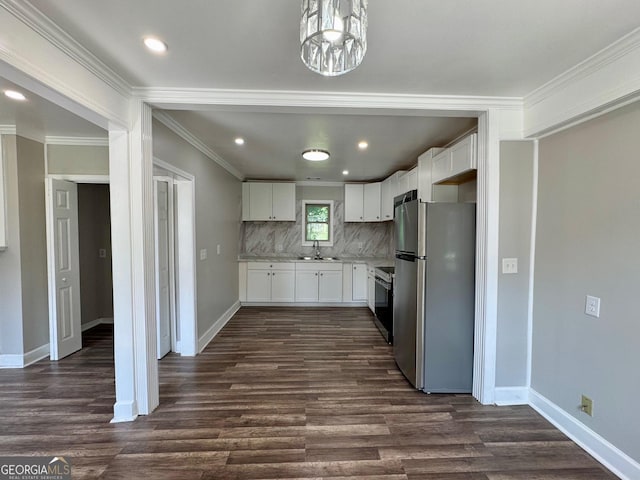1930 Northbrook Ave, Macon, GA 31201 - kitchen featuring freestanding refrigerator, dark wood finished floors, tasteful backsplash, white cabinets, and a chandelier