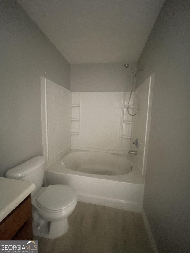 6361 Redan Sq, Lithonia, GA 30058 - bathroom featuring vanity, shower / bathtub combination, and wood finished floors