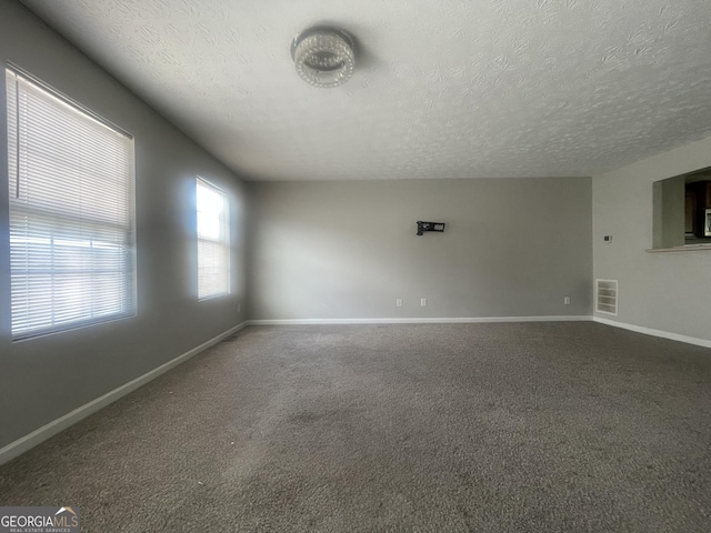 6361 Redan Sq, Lithonia, GA 30058 - carpeted empty room with a textured ceiling
