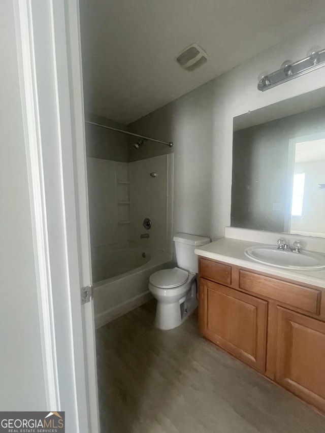 6361 Redan Sq, Lithonia, GA 30058 - full bathroom with vanity, bathtub / shower combination, and wood finished floors
