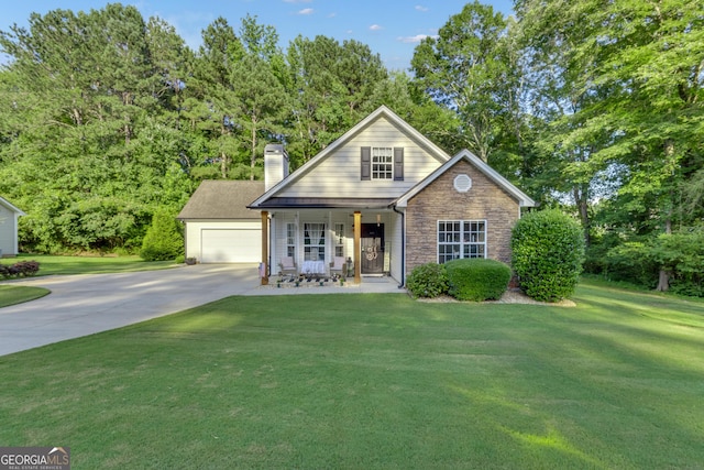 259 Coweta St, Senoia, GA 30276 - traditional-style home with a porch, a front yard, a chimney, stone siding, and view of wooded area