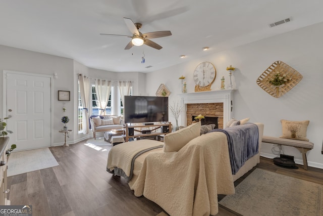 259 Coweta St, Senoia, GA 30276 - living room with wood finished floors, a ceiling fan, a stone fireplace, and recessed lighting