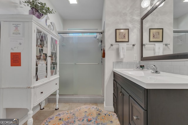 259 Coweta St, Senoia, GA 30276 - full bath featuring vanity, a shower stall, tile patterned flooring, and tasteful backsplash
