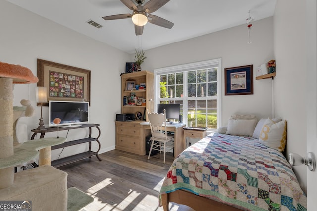 259 Coweta St, Senoia, GA 30276 - bedroom with wood finished floors, an office area, and ceiling fan