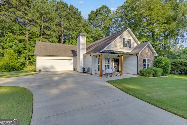 259 Coweta St, Senoia, GA 30276 - view of front of property with concrete driveway, a porch, a chimney, and a front lawn