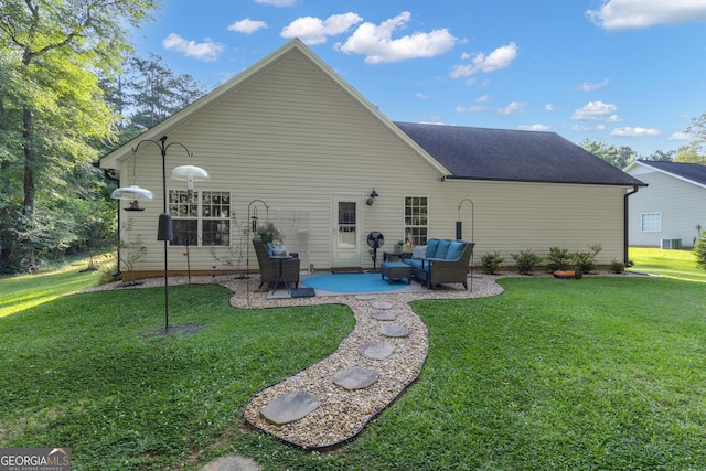 259 Coweta St, Senoia, GA 30276 - back of property featuring a patio area, a yard, an outdoor living space, and a shingled roof