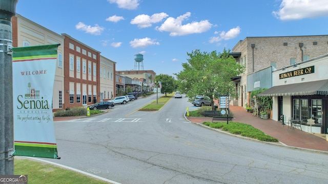 259 Coweta St, Senoia, GA 30276 - view of asphalt street with curbs, street lighting, and sidewalks