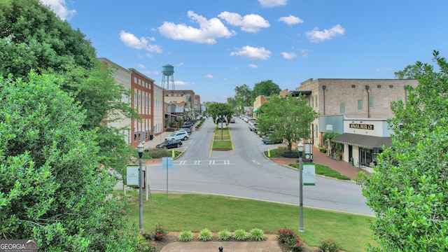 259 Coweta St, Senoia, GA 30276 - view of asphalt road featuring street lights, sidewalks, and curbs