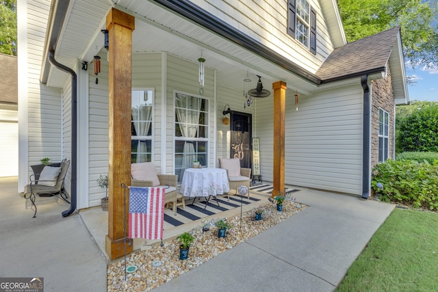 259 Coweta St, Senoia, GA 30276 - property entrance with a porch, roof with shingles, and a garage