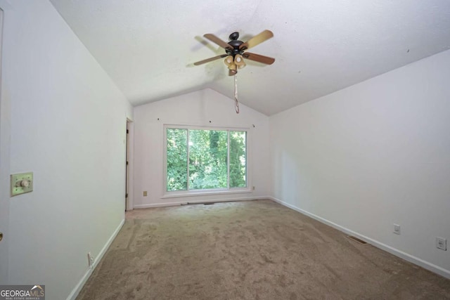7472 Woods Ct, Lithonia, GA 30058 - carpeted empty room featuring lofted ceiling and a ceiling fan