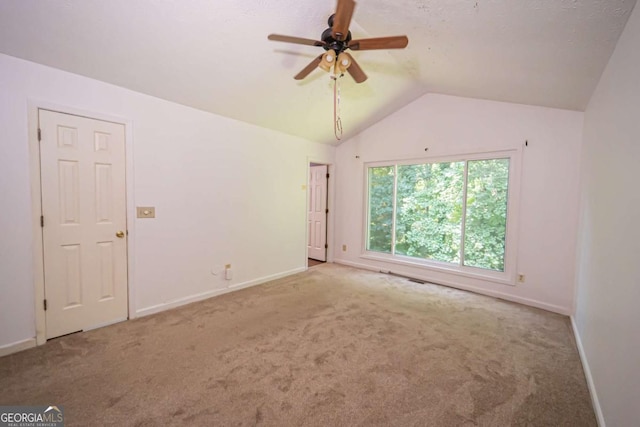7472 Woods Ct, Lithonia, GA 30058 - spare room with carpet, a ceiling fan, and vaulted ceiling