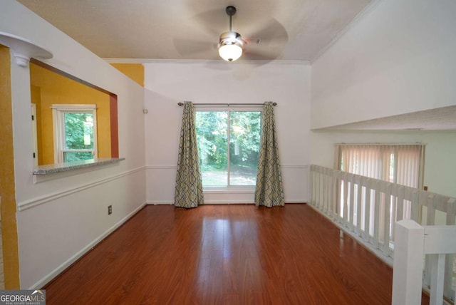 7472 Woods Ct, Lithonia, GA 30058 - spare room featuring a ceiling fan, wood finished floors, and ornamental molding