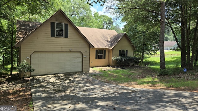1448 SE Hillside Pl, Conyers, GA 30094 - view of front of property with driveway and an attached garage