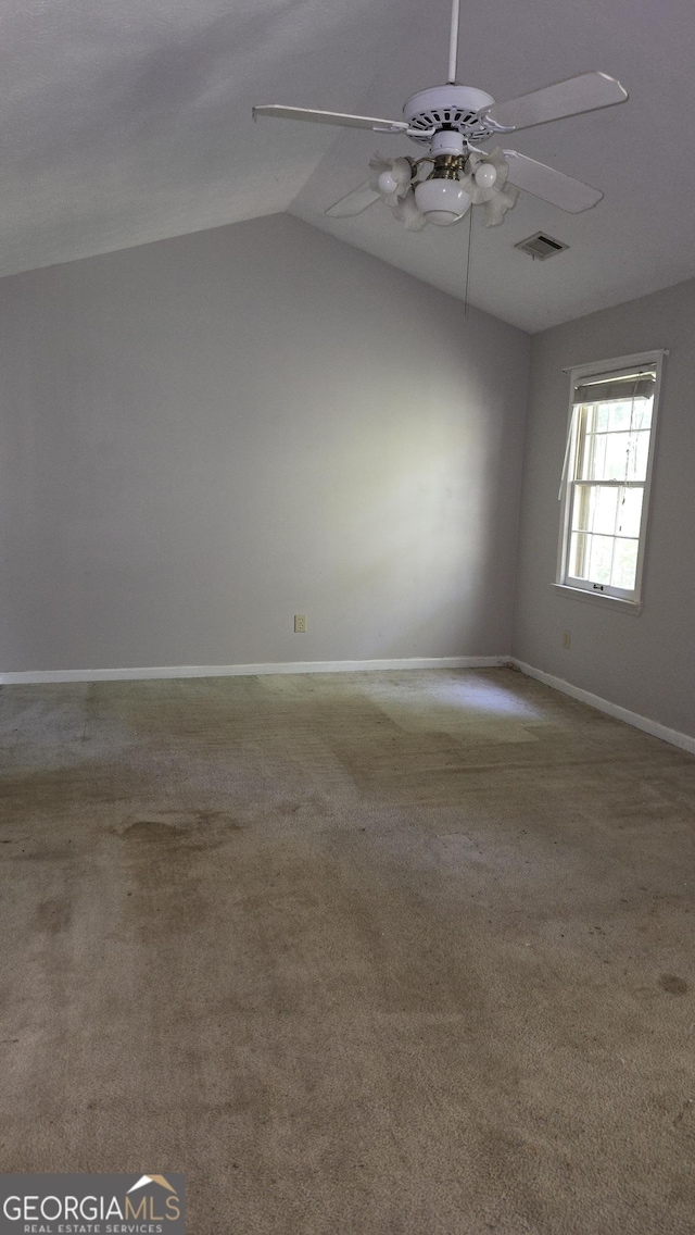 1448 SE Hillside Pl, Conyers, GA 30094 - empty room with ceiling fan, carpet, and lofted ceiling