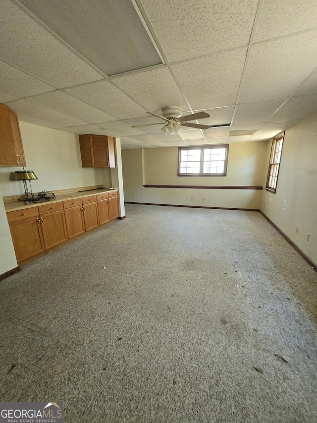 1448 SE Hillside Pl, Conyers, GA 30094 - unfurnished living room with a paneled ceiling and baseboards