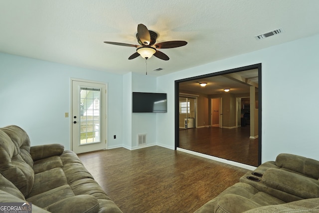 233 S Sheffield St, Kingsland, GA 31548 - living room featuring dark wood-style floors and a ceiling fan