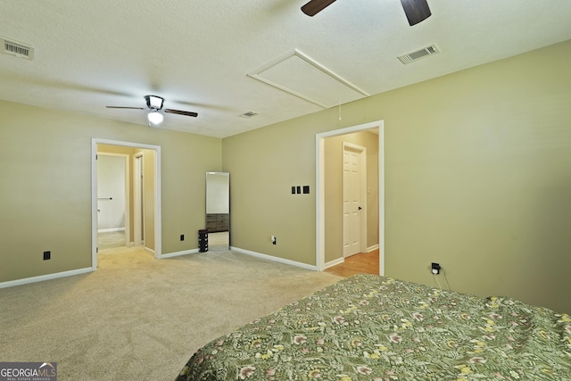233 S Sheffield St, Kingsland, GA 31548 - unfurnished bedroom with carpet flooring, attic access, ceiling fan, and ensuite bathroom