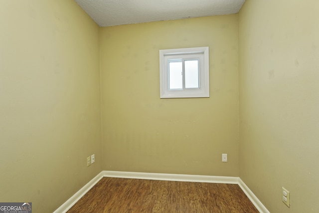 233 S Sheffield St, Kingsland, GA 31548 - unfurnished room featuring baseboards and dark wood finished floors