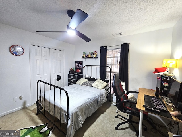 164 Turner Creek Dr, Hampton, GA 30228 - bedroom featuring carpet, a desk, ceiling fan, a closet, and a textured ceiling