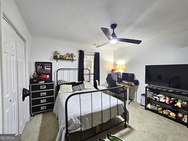 164 Turner Creek Dr, Hampton, GA 30228 - bedroom with carpet floors, a closet, a ceiling fan, and a textured ceiling